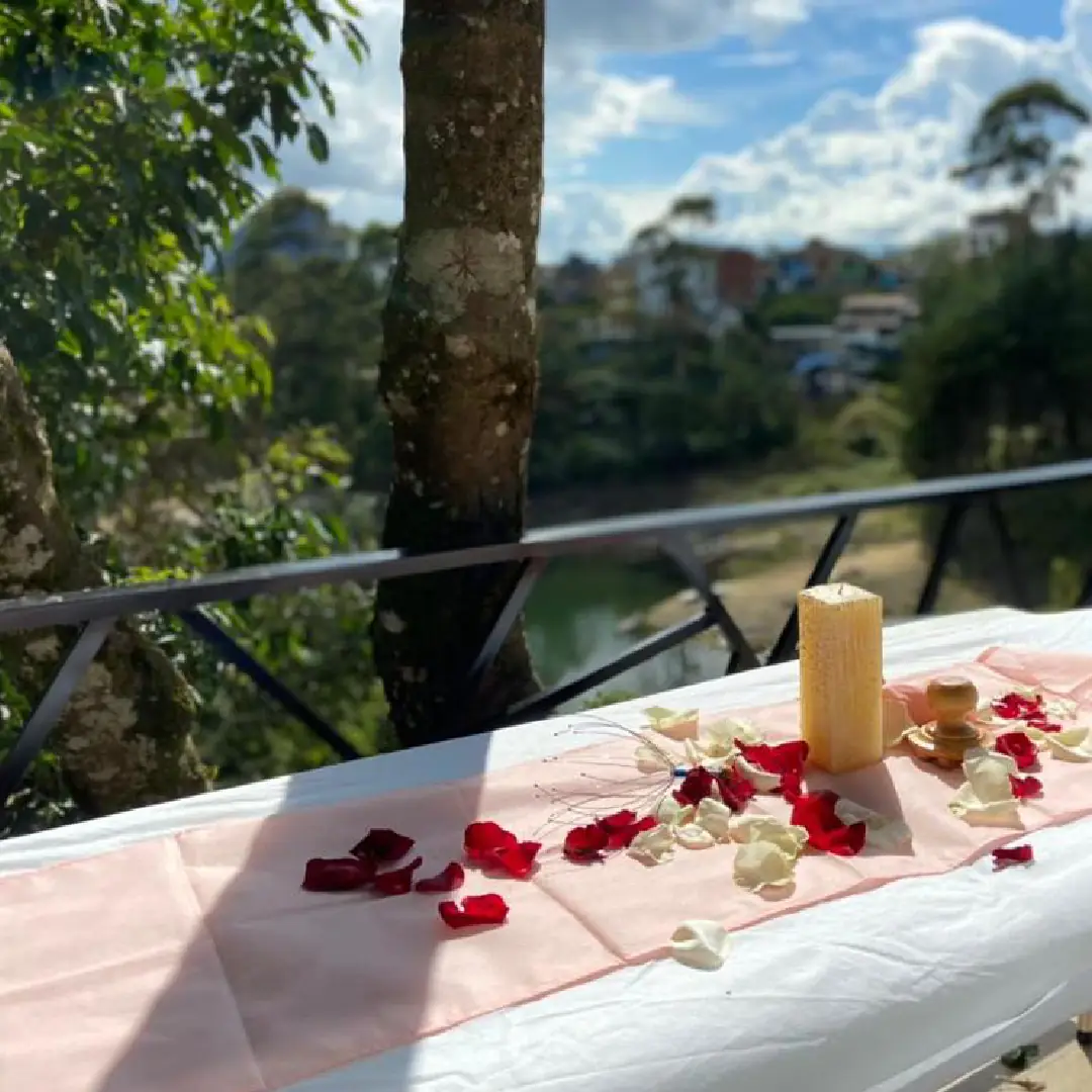 A table set on the balcony looking out over the town and the reservoir.