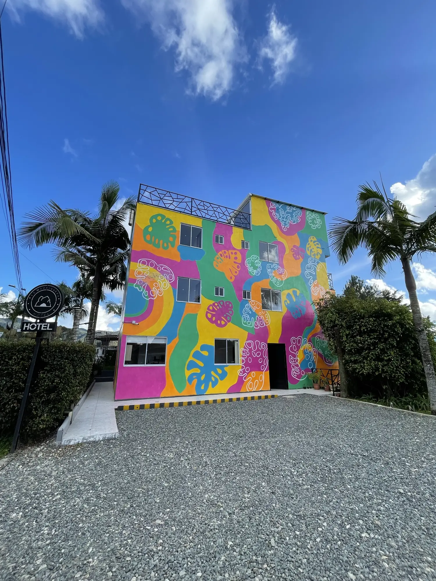 The coloured mural on the hotel façade, by day.